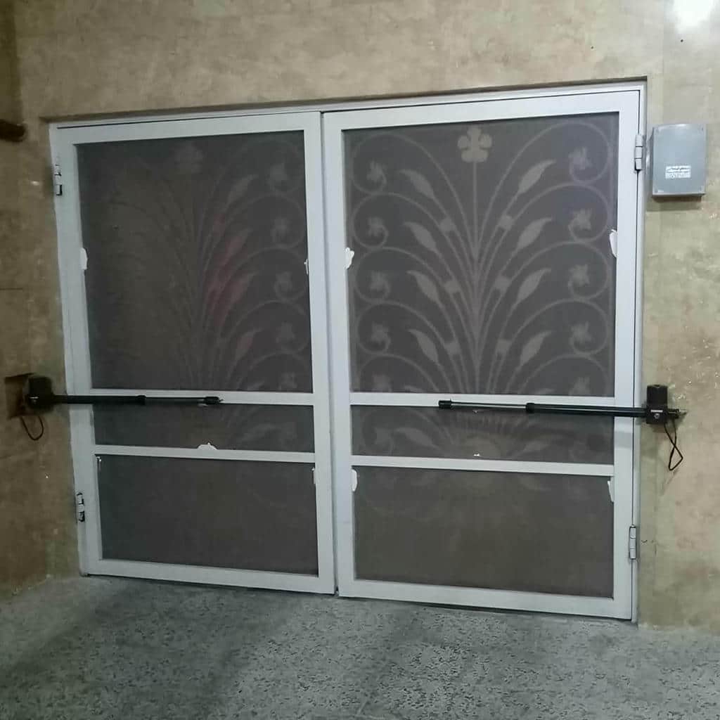 خرید جک درب پارکینگ لولایی شفت بلند با مقایسه کورس بازو